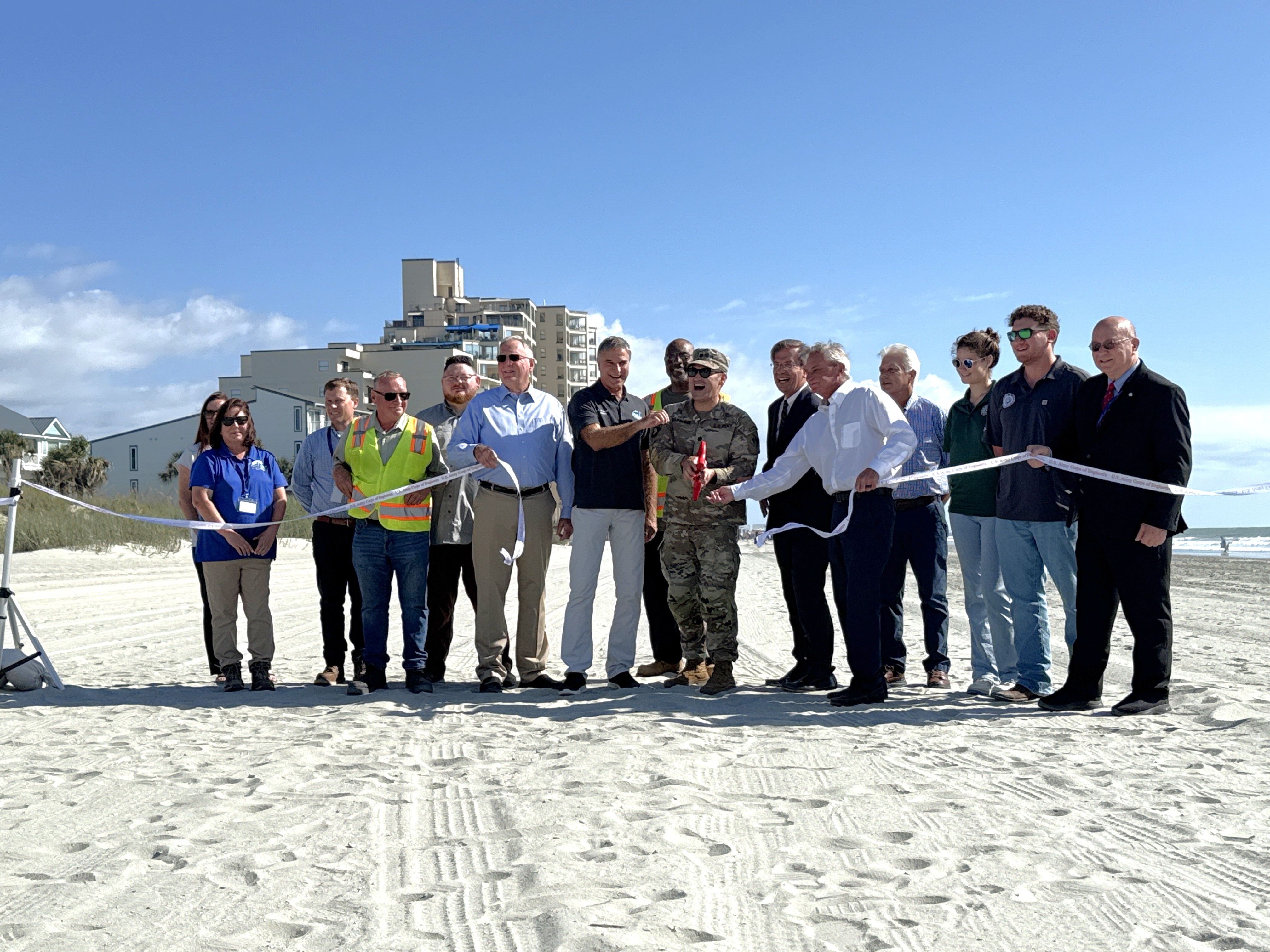 Grand Strand elected officials and employees gather for ceremonial ribbon cutting following beach renourishment project 